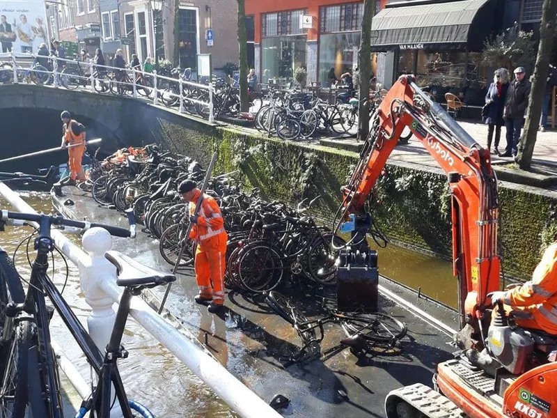 Fishing bicycles from the river in Amsterdam