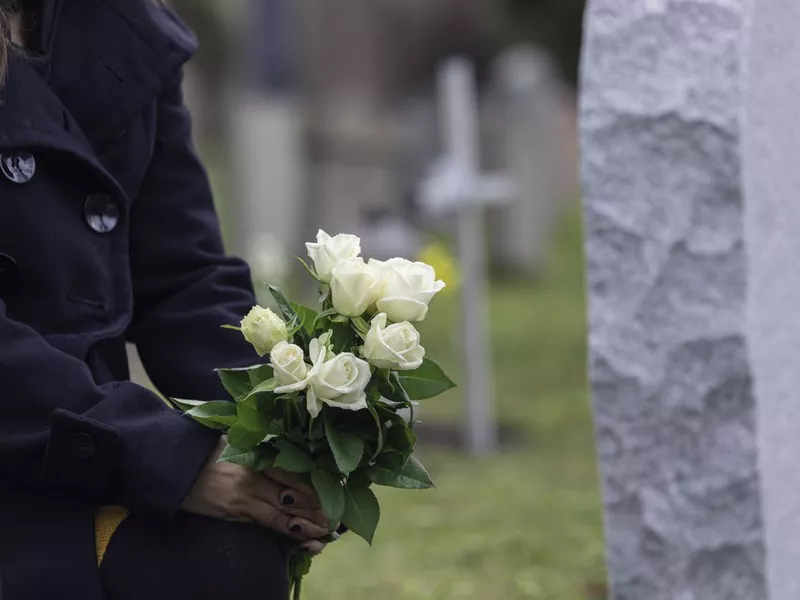 Mourning in front of a grave