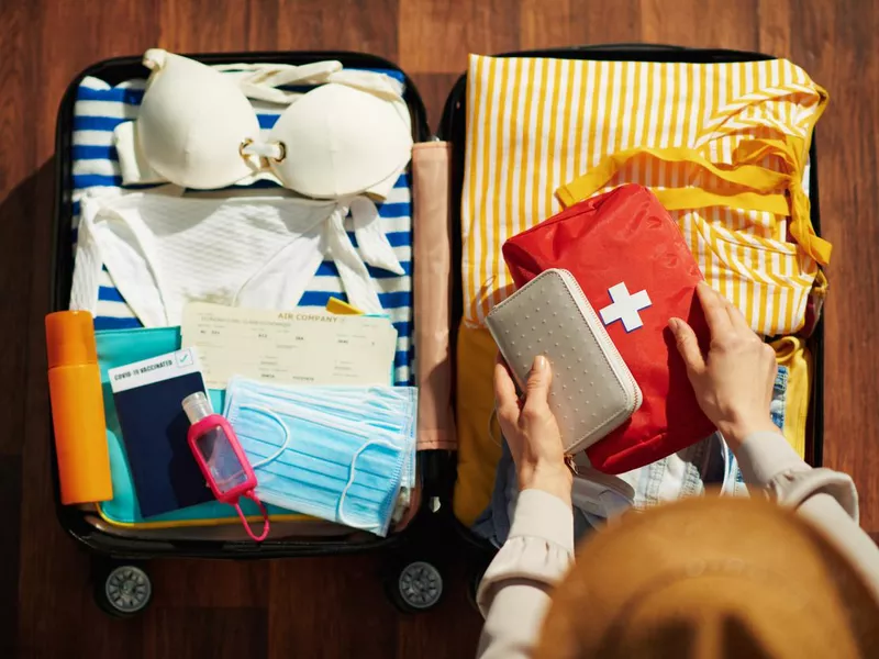 Woman packing a suitcase